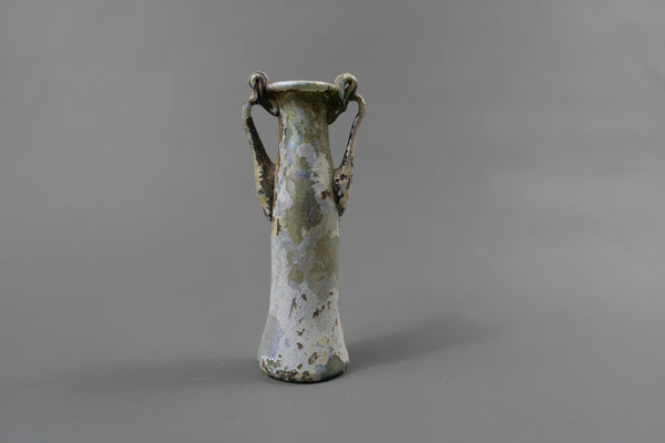 Bottle with two handles.