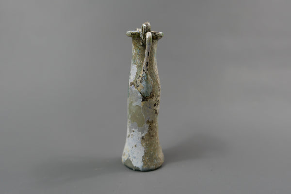 Bottle with two handles.