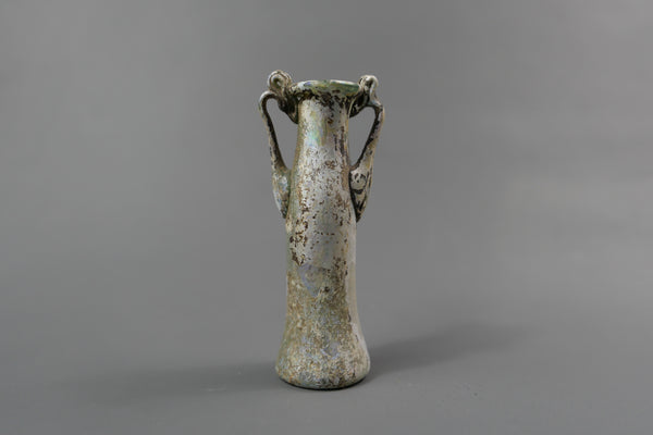 Bottle with two handles.