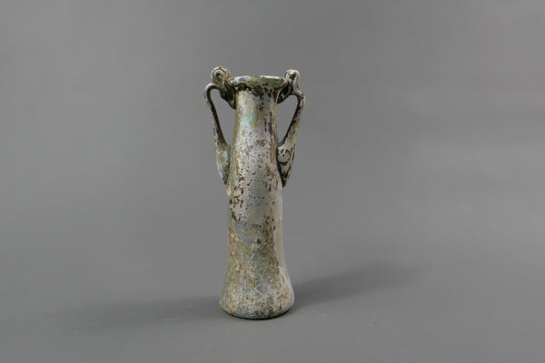 Bottle with two handles.