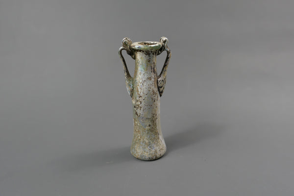 Bottle with two handles.