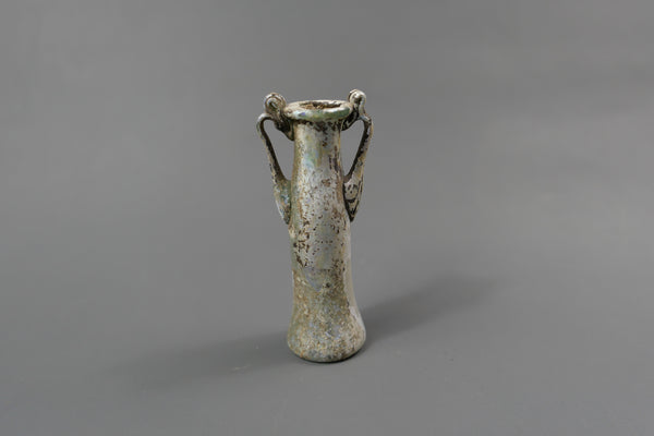 Bottle with two handles.