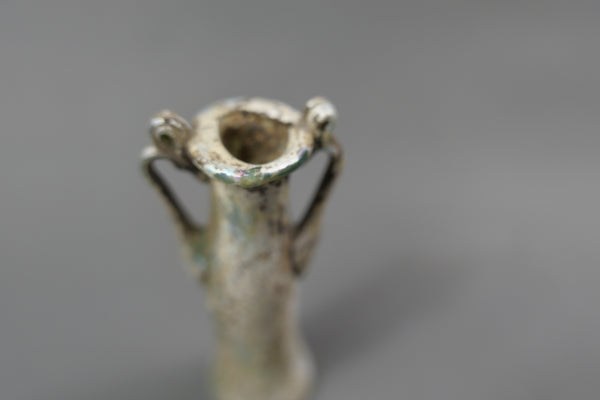 Bottle with two handles.